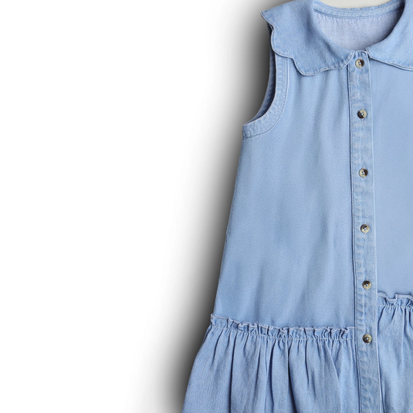Light blue dress with collar and buttons on a white background