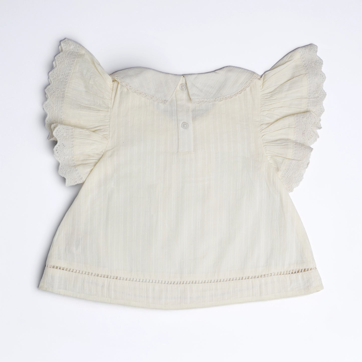 White blouse with ruffled sleeves on a white background