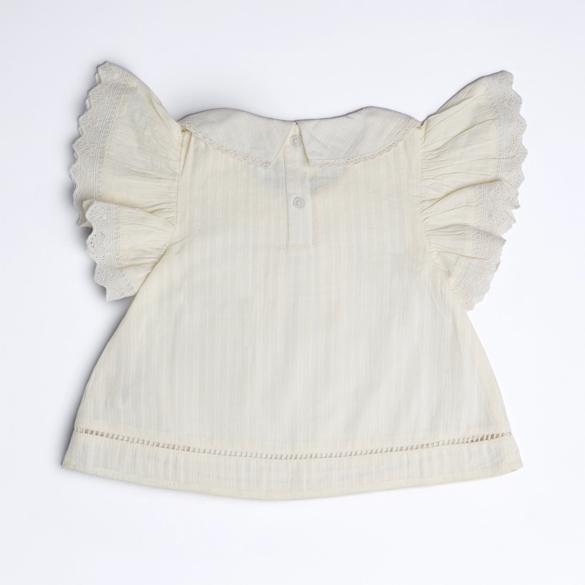 White blouse with ruffled sleeves on a white background