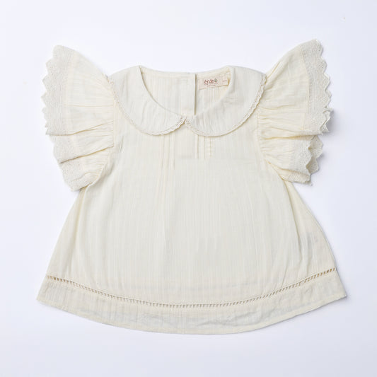 Cream-colored blouse with ruffled sleeves on a white background